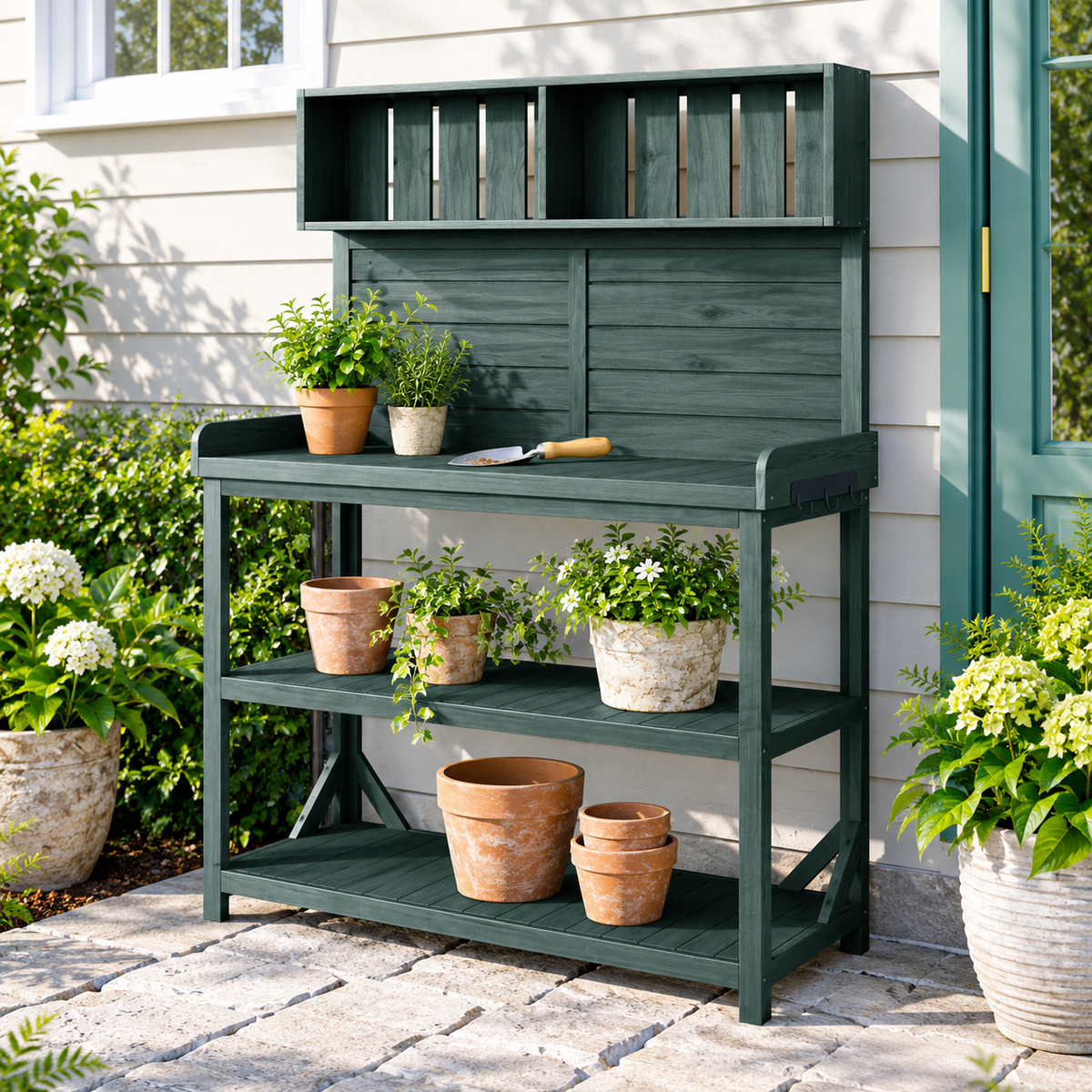 65-in. Wood Potting Bench with Shelves, Forest Green, on a garden patio with pots