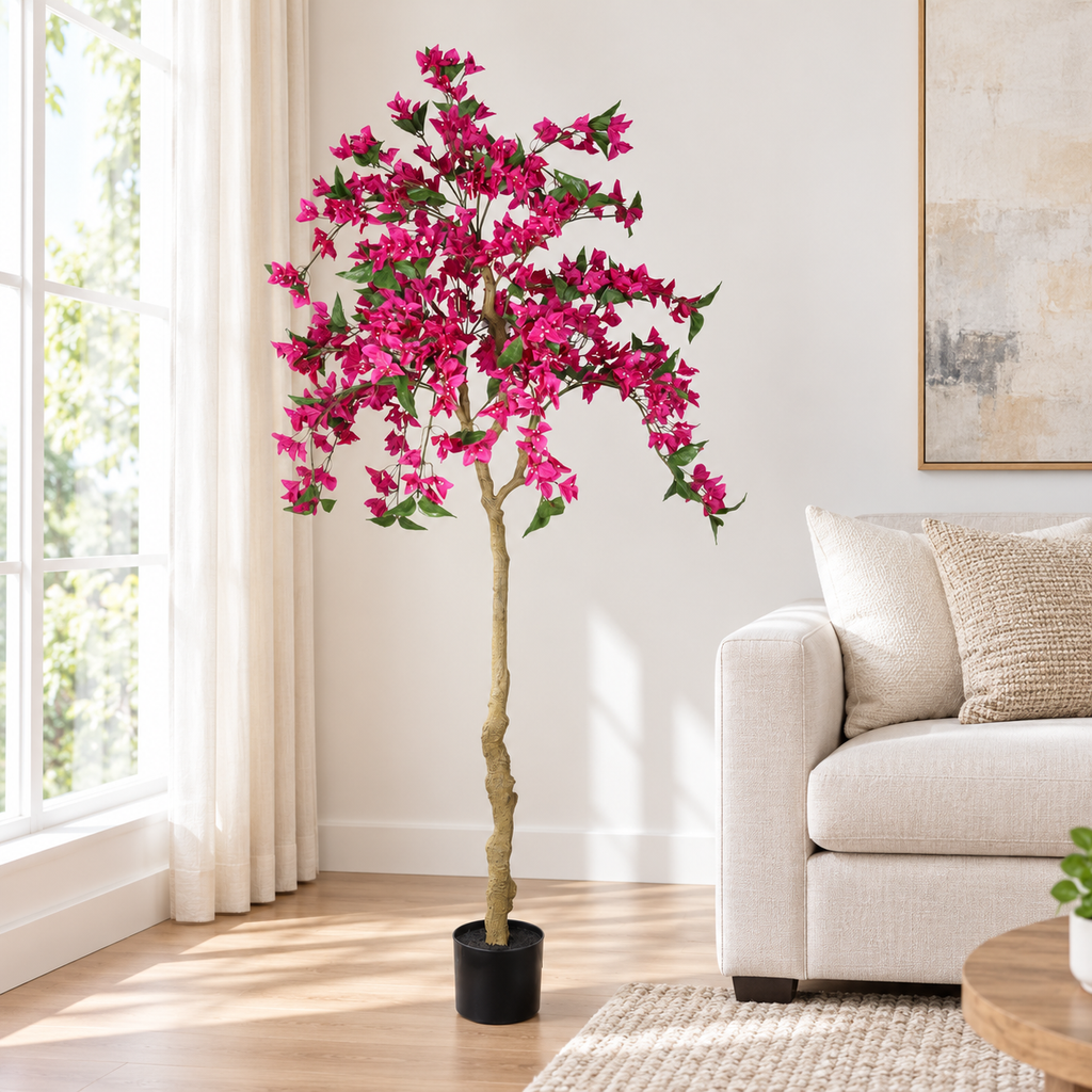6-Foot Artificial Bougainvillea Tree, Dark Pink, beside a sofa in a living room